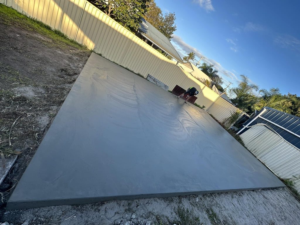 Smooth concrete pathway around residential property