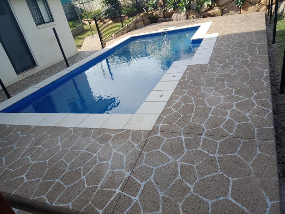 Decorative concrete pool surround with stencil finish